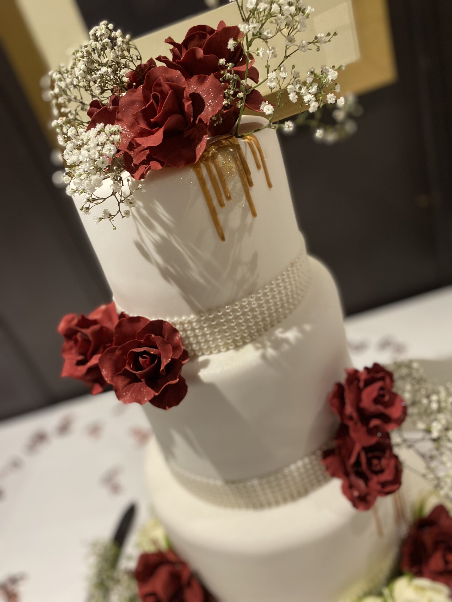 Cream & red roses wedding cake